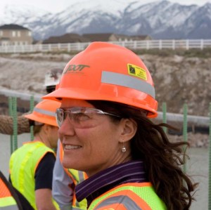 Mountain View Corridor Project Director Teri Newell looks on as crews work on the new 15-mile roadway. Newell has overseen this $1.035 billion project from the beginning.