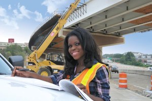 Hermanie Pierre, a Civil Engineer I with the Arkansas State Highway & Transportation Department, inspects Phase III construction for improvements to the Interstate 430-630 interchange in Little Rock.