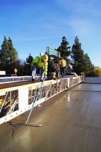 The finisher is smoothing the concrete surface on Interstate 5 (I-5), one mile south of the Hammer Lane exit in Stockton, California, for the $122.1 million I-5 North Stockton Improvements Project. Caltrans is adding sound walls, auxiliary lanes and car-pool lanes, improving safety and mobility in the Central Valley.