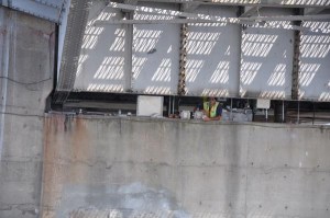 Alfred Banz takes a break while a boat passes by as he works on the mechanical system that operates the Sisters Creek drawbridge on State Road 105 in Duval County for the Florida Department of Transportation.