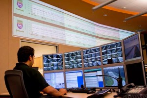 Edwin Melendez, FDOT District Four Regional Transportation Management Center operator, monitors incidents on the mini video wall at a workstation in the control room.