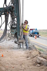 This is a long shot of an explosives driller prepping for rock blasting on Interstate 84 near Boise.