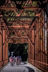 Cyclists ride across an old bridge near Graton, California.