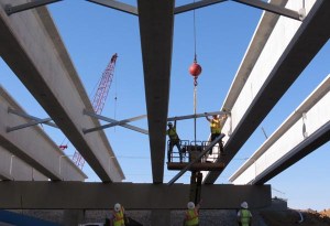 Driving over them, we sometimes forget that the overpasses connecting our communities - and states - are large and require considerable skill to put together. Steelworkers stitch this new one together for a new section of US 68 in Maysville, Ky.