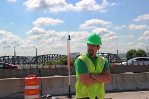 ODOT Transportation Engineer Josh Bowman is shown on the site of the Interstate 75 Modernization in Dayton, Ohio. Josh has played an integral role in all phases of the project to improve safety, decrease congestion, and provide much-needed updates to the more than 50-year-old highway serving the downtown area.