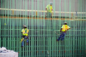 A work crew ties off pieces of reinforcing steel prior the pouring of concrete pier stems for one of the bridges on the Interstate 75 Modernization project in Dayton. The project will ensure this major area corridor will meet the present and future needs of the motoring public.
