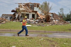 Oklahoma Department of Transportation worker Vaughn Oswald assists with the cleanup following the deadly May 20 tornadoes in Moore. Maintenance crews from ODOT field divisions statewide assisted with debris removal and cleanup following the destructive tornado that struck the Moore area. More than 800 ODOT maintenance workers hauled more than 4,000 tons of storm debris away from the area over a span of two weeks.