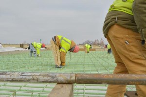 Construction contractors for the Oklahoma Department of Transportation get a good stretch while working on the reconstruction of I-44 at Harvard Avenue in Tulsa.