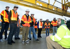 OBEC Consulting Engineers’ Brad Larsen led students from Churchill High School’s science, technology, engineering and mathematics program on a tour of the Oregon Department of Transportation’s Interstate 5 Willamette River Bridge project. Larsen explained the bridge’s design to the students, who used their learning on their own bridge design project.