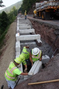 A PennDOT crew in Engineering District 3-0 expands its in-house capabilities with the installation of a retaining wall along Traffic Route 414 in the Pine Creek Valley of Lycoming County, PA.