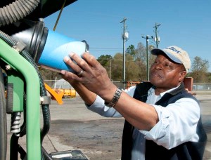 Herbert Brown checks the air filter on a tractor during a vehicle inspection before going out to trim vegetation along the highways in Colleton County, South Carolina. Brown is the vegetation foreman for the South Carolina Department of Transportation’s Colleton Maintenance Office.