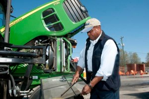 Herbert Brown checks the air filter on a tractor during a vehicle inspection before going out to trim vegetation along the highways in Colleton County, South Carolina. Brown is the vegetation foreman for the South Carolina Department of Transportation’s Colleton Maintenance Office.