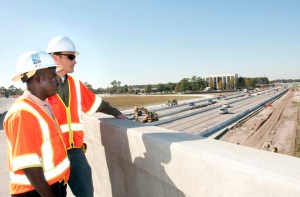 Rickie Green of SCDOT’s Charleston Contruction B Office, left, and HDR Project Manager David Wertz supervise the construction work on Interstate 26 in North Charleston, SC.