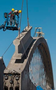 The West 7th Street Bridge is a gateway between downtown Fort Worth and its cultural district. An obsolete bridge is being replaced by the world’s first pre-cast network arch bridge, which will accommodate multimodal access.  TxDOT’s futuristic design is constructed with 12 precast arches, which were completed off site.