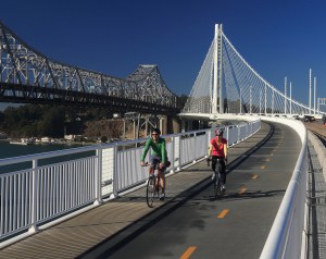 Bay Area residents John Davidson and Thalia Pascalides enjoy cycling on the new San Francisco-Oakland Bay Bridge Pedestrian and Bicycle Pathway on October 14, 2013. Since opening on September 2, 2013 many cyclists have enjoyed breathtaking vistas from the new bridge and observed demolition of the old Bay Bridge.