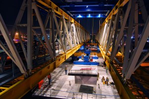 A section of a bridge being moved into place on the State Road 826/State Road 836 Interchange Reconstruction Project. There are 45 bridges in the project. The gantry was used to construct 4 of them because the confined space below precluded the use of cranes.