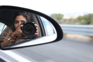 Photographer Sholeh Moll of the Nevada Department of Transportation photographs semi-trucks and other traffic related images from the passenger seat of a state car while on a trip through rural Nevada.